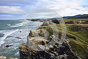 rocky ocean shore. Praia de Augas Santas, Ribadeo photo