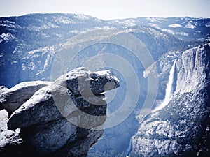 Rocky outcrop with waterfall photo