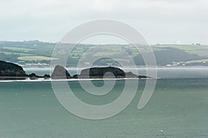 Rocky Outcropping Jutting Into Sea photo