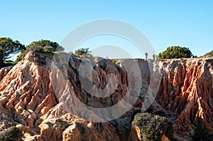 Rocky outcroppings in Algarve, Portugal, represent soil erosion by water.