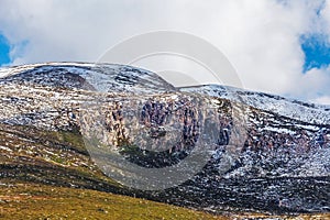 Rocky outcrops covered in snow at Mount Kosciuszko National Park photo