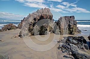 Rocky outcrops on ogunquit maine ocean beach photo