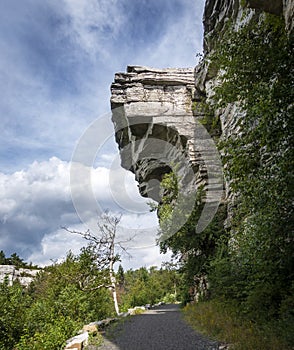 Rocky Overhang Above a Mountain Trail photo