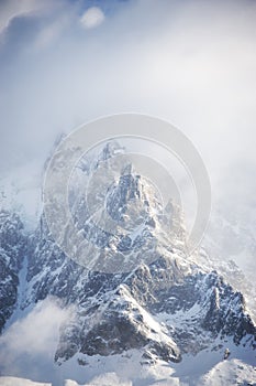 Rocky peaks covered with snow in French Alps