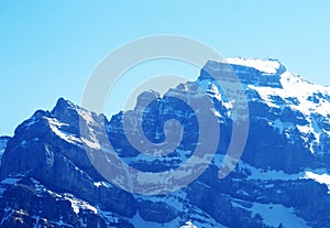 Rocky peaks HÃÂ¶chtor Hoechtor or Hochtor and VrenelisgÃÂ¤rtli Vrenelisgaertli in Glarus Alps mountain range, over KlÃÂ¶ntalersee