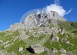 Rocky peaks and stones with grass in Caucasian mountains