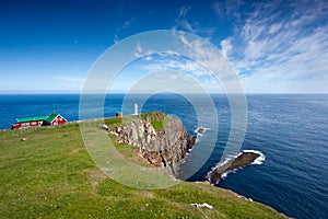 Rocky promontory with a lighthouse photo