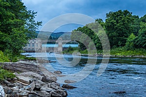 A rocky River Tummel and Pitlochry Dam at twilight on a summers evening