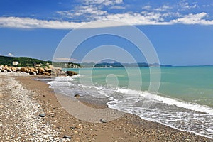 Rocky sandy beach on a bright Sunny day