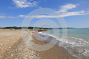 Rocky sandy beach on a bright Sunny day