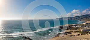 Rocky and sandy coastlines of Portugal ocean coast. Aerial view of Guincho beach