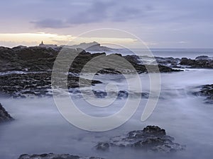 Rocky sea beach at dusk