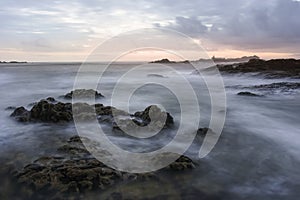 Rocky sea beach at dusk