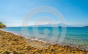 Rocky sea coast line near mountains landscape