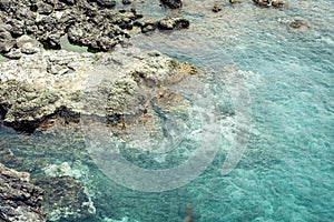 Rocky sea shore of Acitrezza next to Cyclops islands, Catania, Sicily, Italy