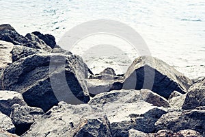 Rocky sea shore of Acitrezza next to Cyclops islands, Catania, Sicily, Italy