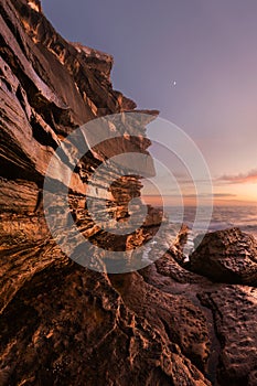 Rocky seascape with Moon