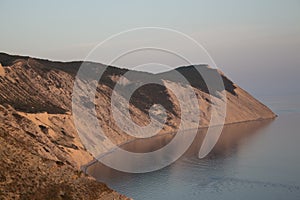 Rocky seashore, calm, sunset beams of natural light, natural romance, peace of mind in unity with nature photo