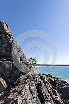 Rocky seashore with crushing foamy waves