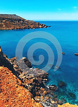 Rocky seashore at Ghajn Tuffieha, Malta photo