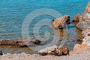 Rocky seashore in Greece on a sunny day