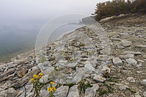 Rocky shore in the early morning of Ticha Dam