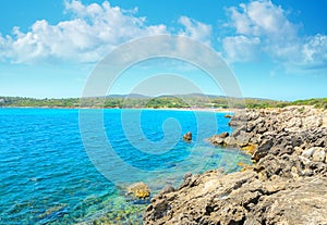 Rocky shore with Lazzaretto beach in the background photo