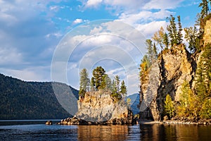 The rocky shore of a mountain lake