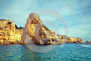 Rocky shore near Praia da Marinha beach and Benagil in Algarve region in Atlantic ocean, Portugal,