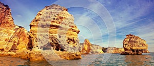 Rocky shore near Praia da Marinha beach and Benagil in Algarve region in Atlantic ocean, Portugal, Europe