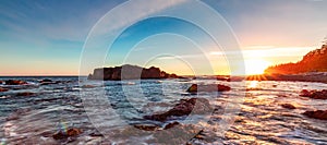 Rocky Shore on Pacific Ocean West Coast during Sunny Sunset. Vancouver Island