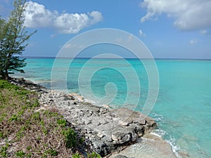 rocky shore of san salvador bahamas, turquoise water nice tropical reefs