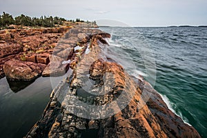 The rocky shore of Tee Harbour