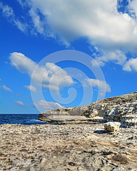 Rocky shore under clouds in Sardinia