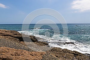 Rocky Shoreline Against Ocean Sky Coastal Landscape