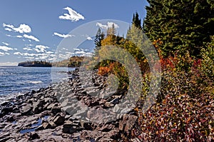 A rocky shoreline along Lake Superior in autumn