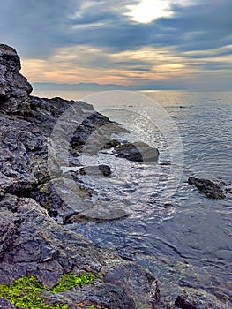 Rocky shoreline of Friday Harbor in San Juan Island, WA, on an overcast day