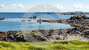 Rocky shoreline at Inishbofin or White Cow Island with the horizon over the Atlantic Ocean photo