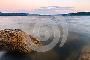 Rocky Shoreline of a lake at sunset