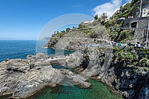 The rocky shoreline at Manarola village in coastal area of Manarola village National Park. Liguria, Italy