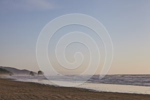 Rocky shoreline of the Pacific Ocean at Cannon Beach, Oregon, USA