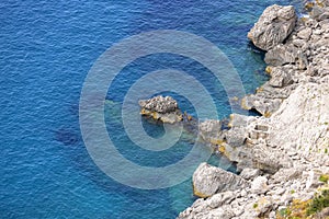 Rocky shoreline on the Tyrrhenian Sea nearby Marina Piccola, Capri Island, Italy