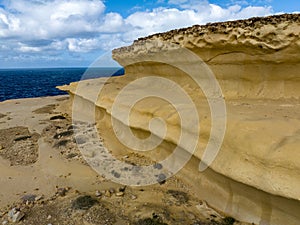 Rocky shores from above aerial snapshot revealing the island\'s untamed coastal allure