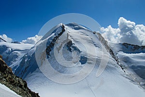 Castor summit on Monterosa traverse knife edge snow ridge glacier walk and climb in the Alps