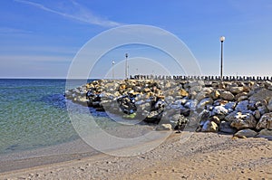 Rocky snowy seashore photo