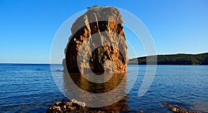 Rocky standing among the blue sea