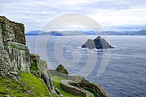 Rocky steep Little Skellig Island in the Atlantic Ocean, off of Ireland, as seen from Skellig Michael Island, larger of the two.