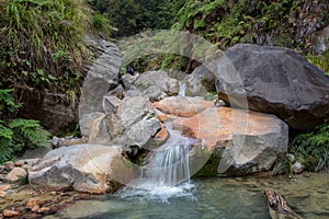 Rocky stream with clear water on a mountain. Beautiful landscape of mount Papandayan. Papandayan Mountain is one of the favorite