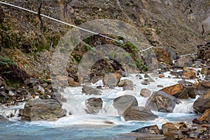 Rocky stream with white water on a mountain. Beautiful landscape of mount Papandayan. Papandayan Mountain is one of the favorite