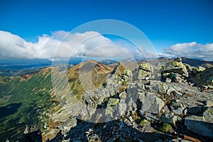 Rocky Tatra mountain tourist hiking trails under blue sky in Slovakia